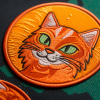 Jacky138_Design_an_Embroidered_Velcro_patch_featuring_an_orange_4287c6bf-aa53-4e08-b77b-573cb8...png