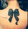 6-Amazing-black-lace-ribbon-tattoo.jpg