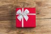 gift-box-tied-red-ribbon-with-small-red-hearts-printed-on-it-on-old-wooden-background_1205-1990.jpg
