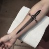 Traditional-black-dagger-tattoo-on-the-inner-arm.jpg