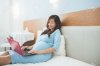 45151332--Asian-pregnant-woman-using-laptop-on-the-bed-smile-&-relax-Stock-Photo.jpg