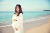 41979687-happy-asian-pregnant-woman-smile-while-touching-her-tummy-on-the-beach.jpg