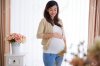 45151281-A-portrait-of-a-happy-pregnant-asian-woman-touching-her-big-belly-Stock-Photo.jpg