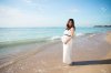 45150460-happy-pregnant-asian-woman-smile-&-pose-in-a-sea-shore.jpg