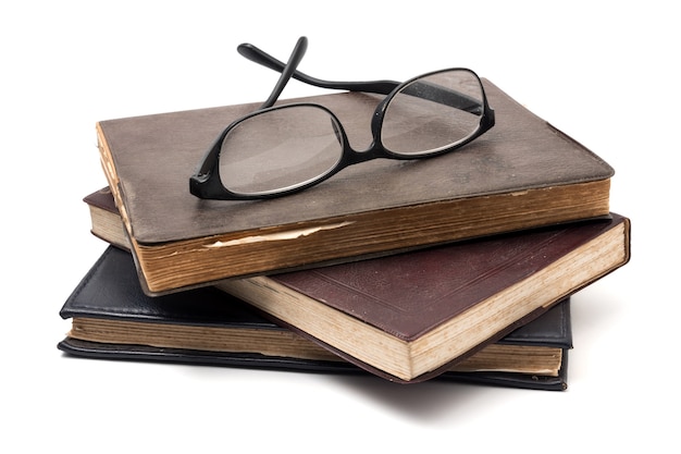 stack-old-books-with-eyeglasses-white-background_35378-22.jpg