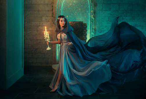 luxury-lady-queen-medieval-royal-dress-run-escapes-from-gothic-night-picture-id1202126741
