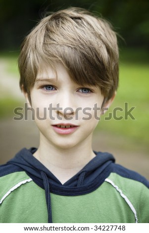 stock-photo-portrait-of-young-smiling-boy-ten-years-old-with-blue-eyes-34227748.jpg