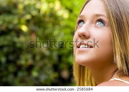 stock-photo-a-young-pretty-teenage-girl-with-blue-eyes-and-blond-hair-looks-the-sky-2585684.jpg