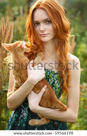 stock-photo-natural-beautiful-red-haired-girl-holds-on-hands-of-a-red-haired-cat-kitten-59566198.jpg