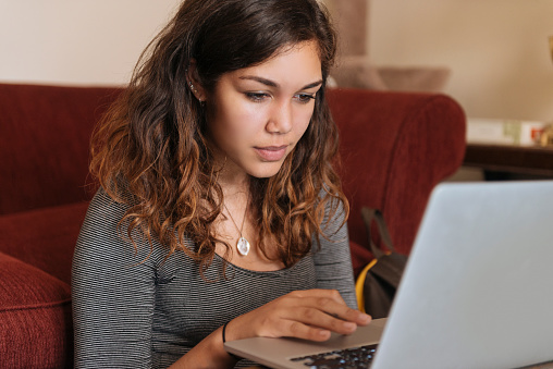 young-woman-studies-on-computer-at-home-for-higher-education-picture-id494056226