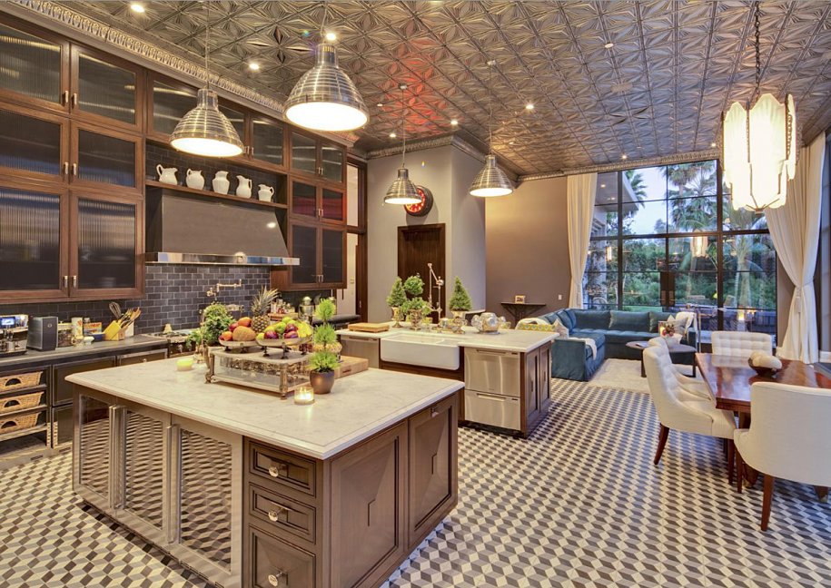 the-kitchen-has-a-unique-tin-ceiling-two-islands-and-a-breakfast-nook.jpg