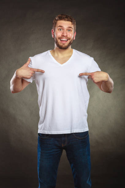man-guy-in-blank-shirt-with-copy-space-pointing-picture-id925758398