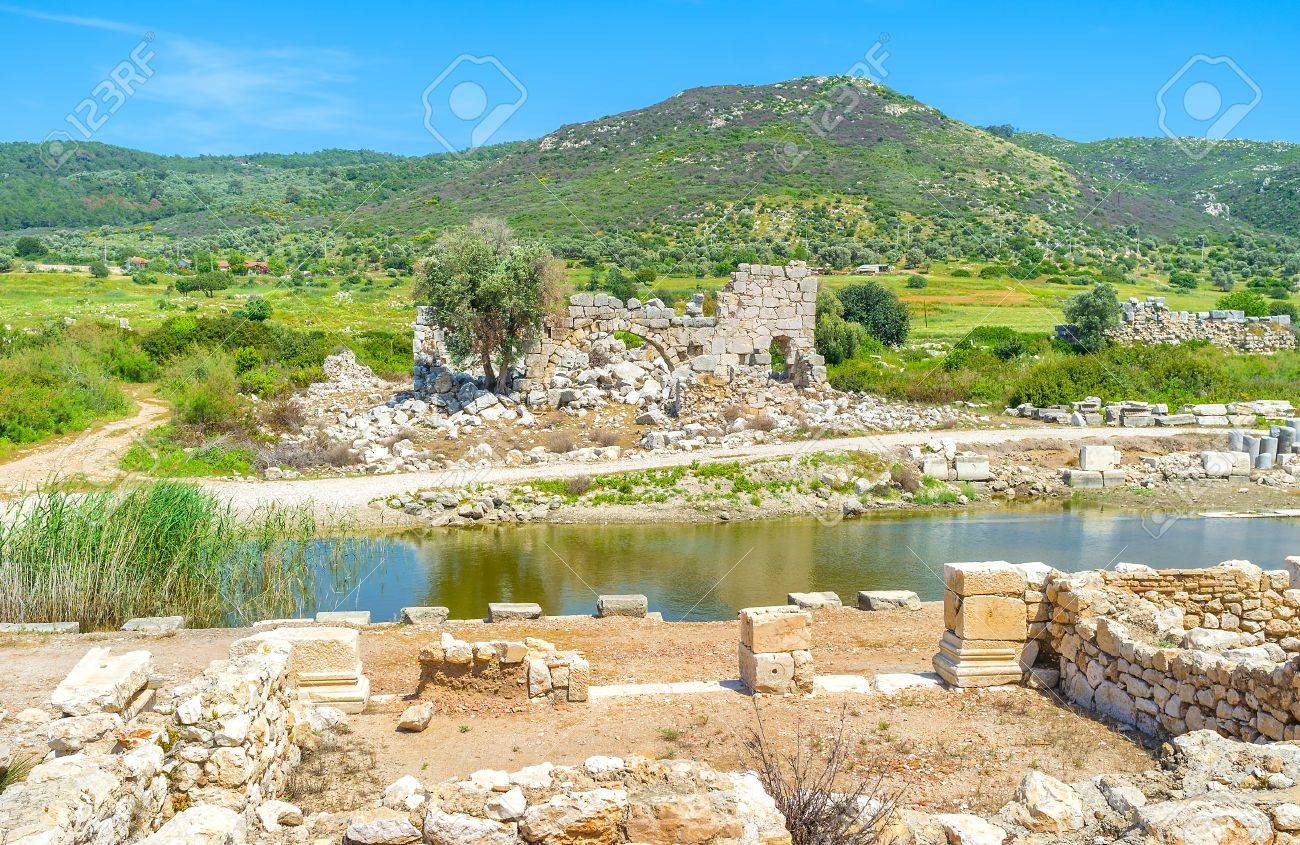 81038441-the-view-on-swamped-ancient-port-with-the-harbor-baths-on-the-background-patara-turkey.jpg