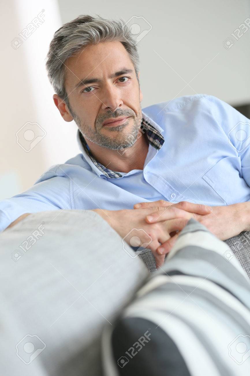 38883568-smiling-handsome-45-year-old-man-relaxing-at-home.jpg
