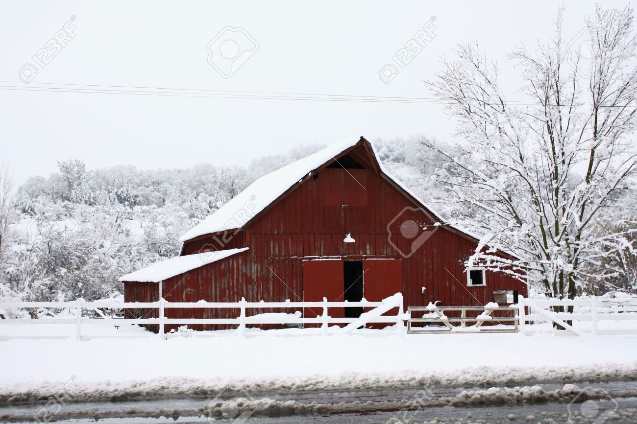 6076772-big-red-barn-in-the-snow.jpg
