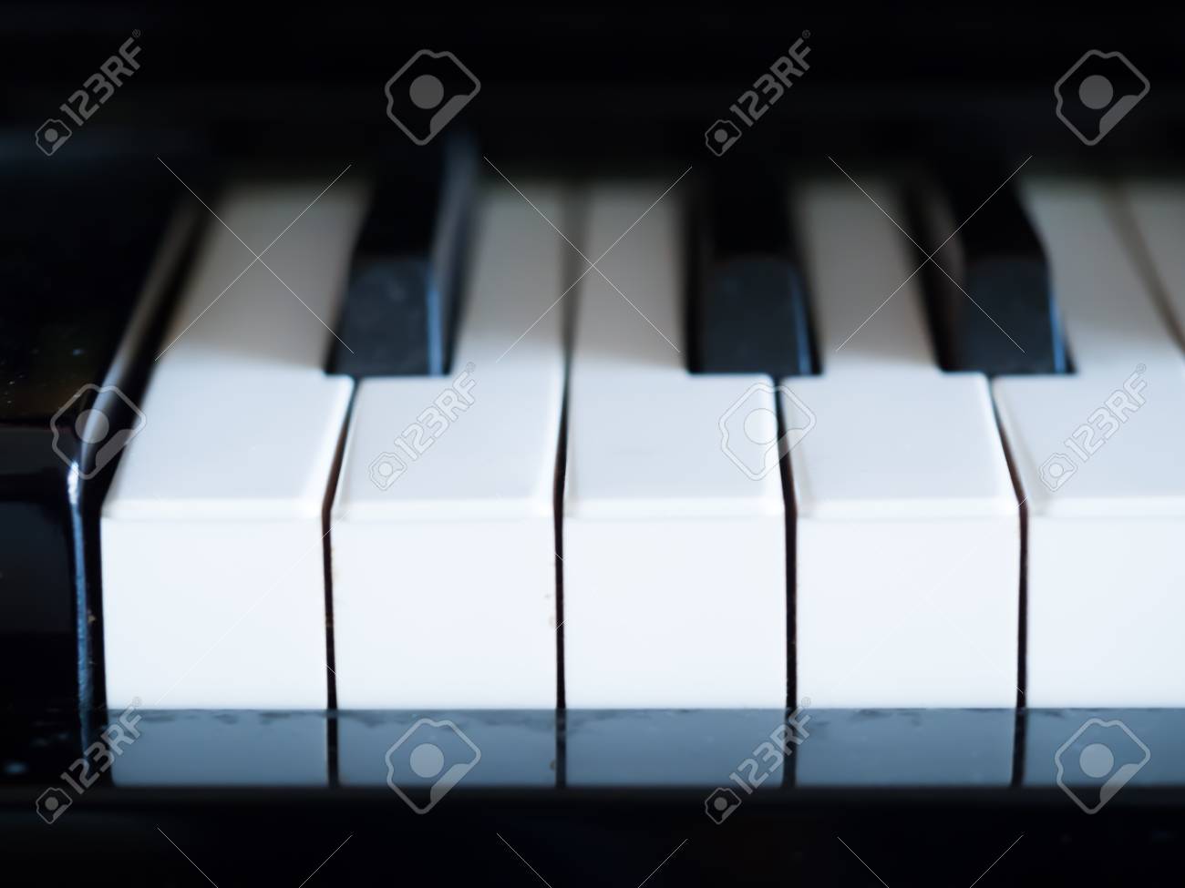 75990064-low-key-tone-closeup-of-piano-keys-.jpg