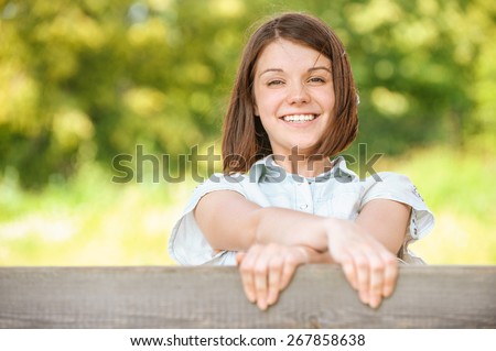 stock-photo-portrait-of-young-cheerful-happy-brunette-woman-wearing-white-chemise-at-summer-green-park-267858638.jpg