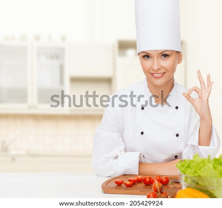 stock-photo-cooking-and-food-concept-smiling-female-chef-with-vegetables-showing-ok-sign-205429924.jpg