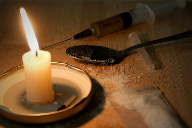 drug-syringe-cooked-heroin-spoon-cocaine-bag-sca-scattered-candle-burns-evening-84327687.jpg