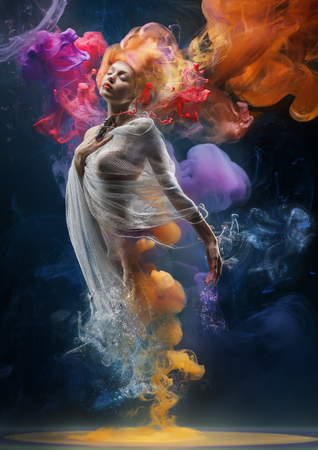 60888898-fantasy-fashion-model-inside-colorful-clouds-water-paint-spreading-underwater-fantastic-shapes-in-de.jpg