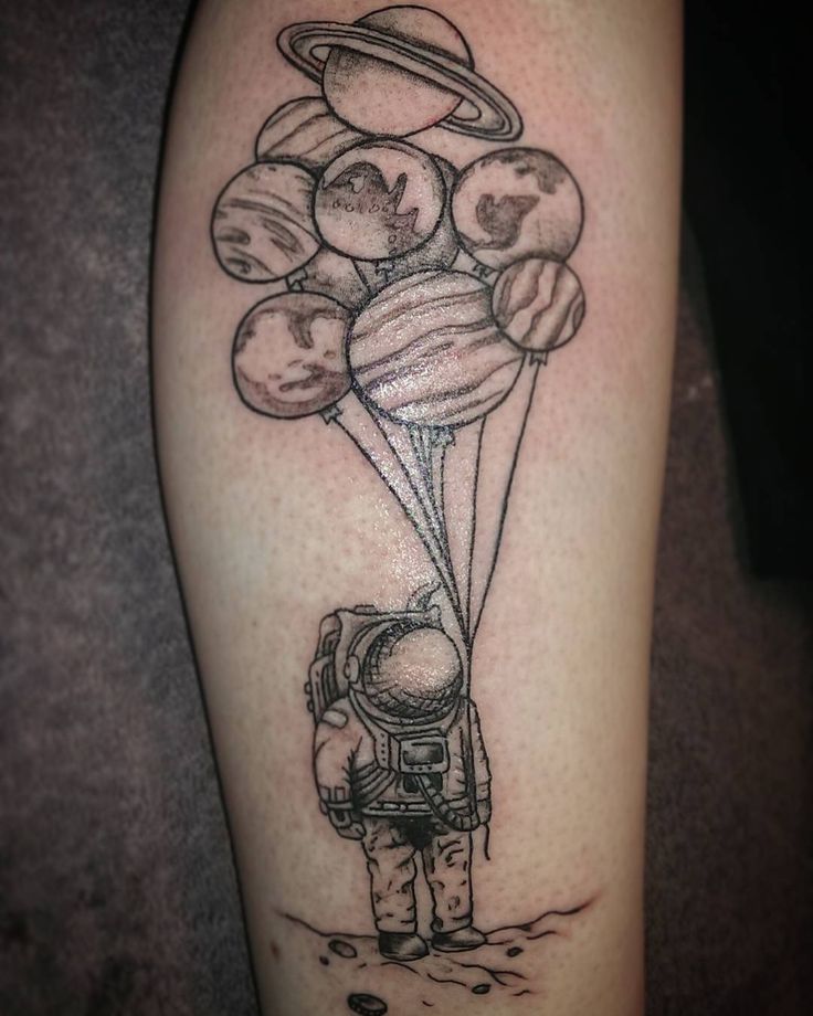 Grey-Ink-Astronaut-With-Planet-Baloons-Tattoo-On-Leg.jpg