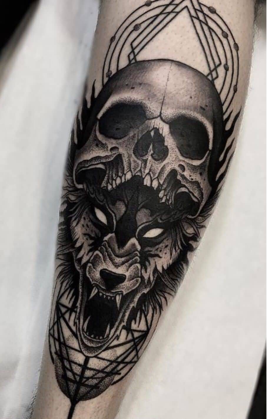 Wolf-and-Skull-Tattoo-On-Forearm.jpg